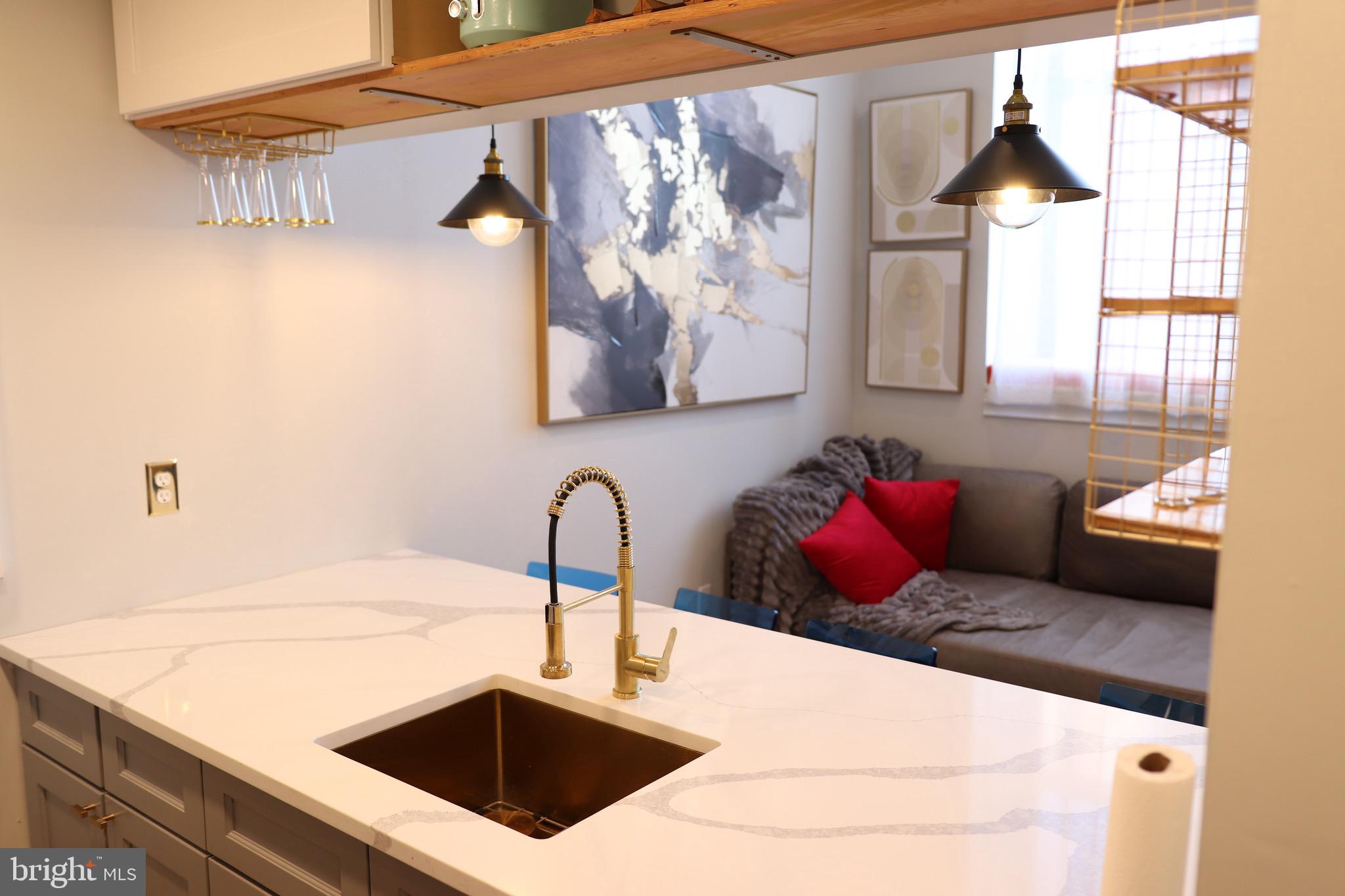 1601 Spring Garden Street, Unit 318 Philadelphia, PA 19130 - Photo 3 of 31 a bathroom with a sink and a mirror