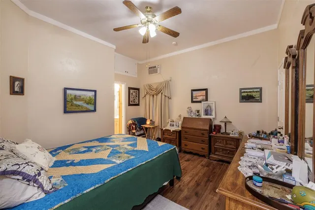 a bedroom with bed and a chandelier