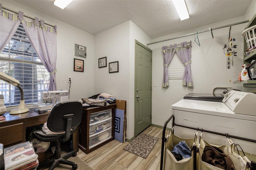 9953 Green Tree Lane Wills Point, TX 75169 - Photo 16 of 39 a view of a workspace with furniture and a window