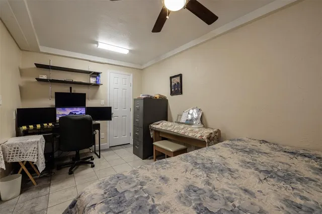 a bedroom with a bed and a chair