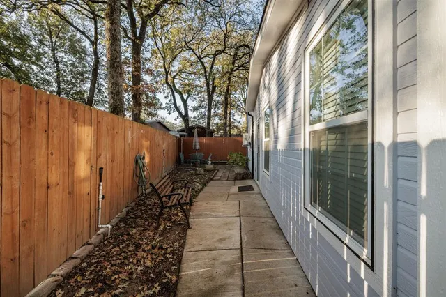 a view of a pathway of a house with a yard