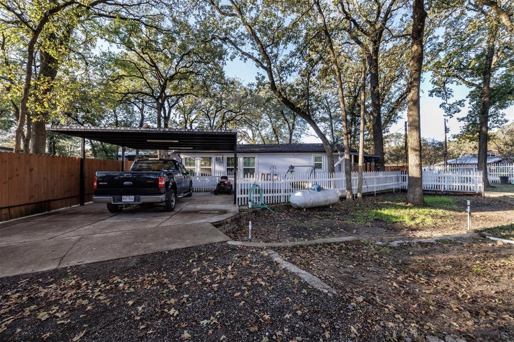 9953 Green Tree Lane Wills Point, TX 75169 - Photo 21 of 39 a front view of a house with garden