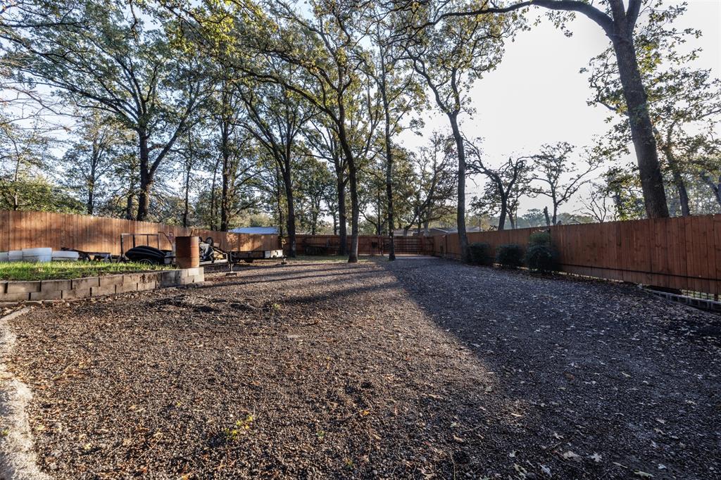 9953 Green Tree Lane Wills Point, TX 75169 - Photo 31 of 39 a backyard of a house with lots of green space
