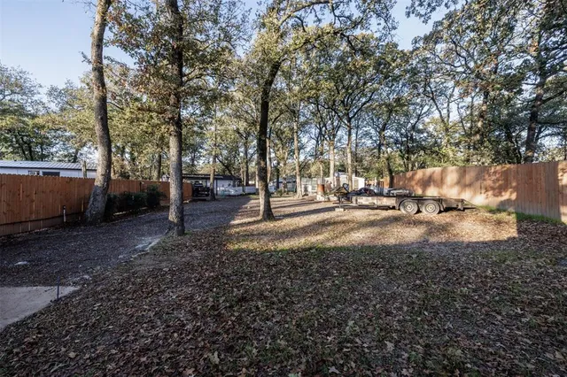 a view of swimming pool with a yard