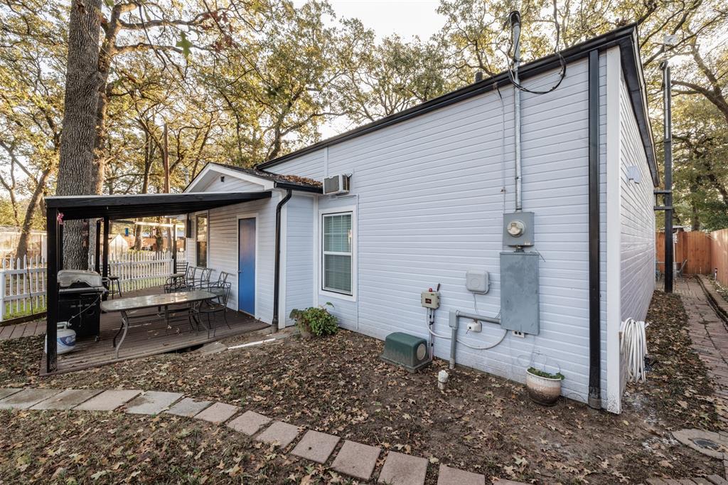 9953 Green Tree Lane Wills Point, TX 75169 - Photo 7 of 39 a backyard of a house with barbeque oven table and chairs