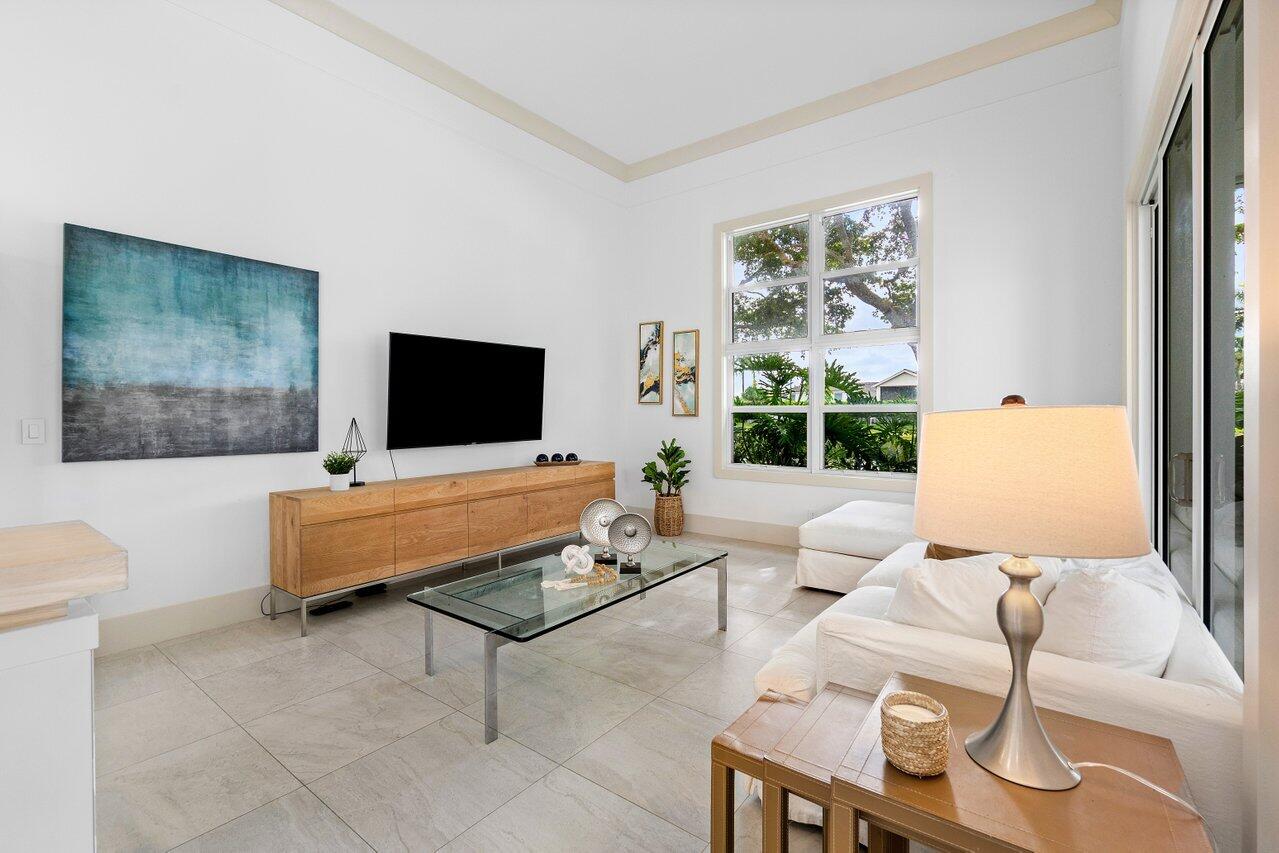 5848 Northwest 39th Avenue Boca Raton, FL 33496 - Photo 13 of 37 a living room with furniture and a flat screen tv