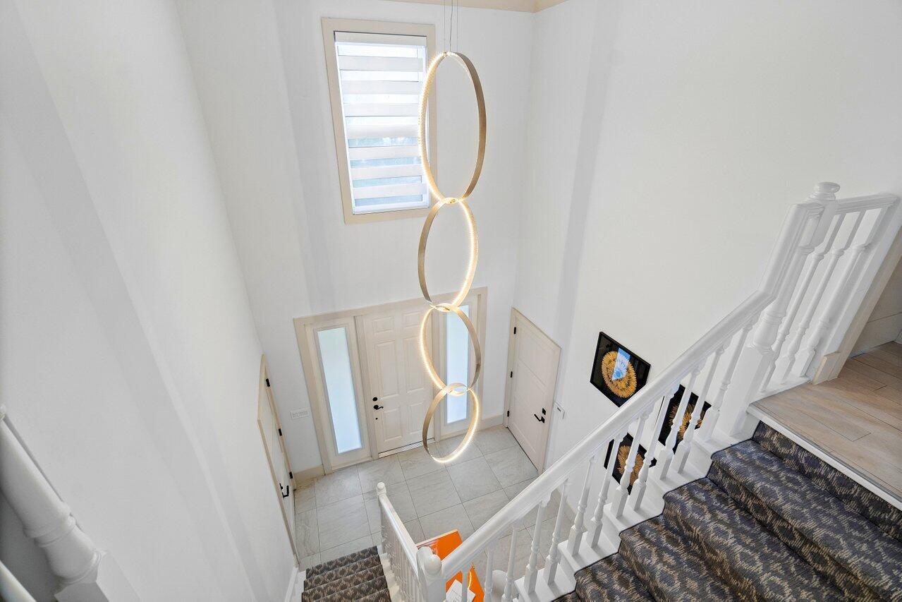 5848 Northwest 39th Avenue Boca Raton, FL 33496 - Photo 16 of 37 a picture of a room with wooden floor and white walls