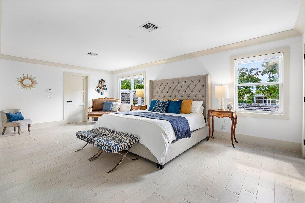 5848 Northwest 39th Avenue Boca Raton, FL 33496 - Photo 18 of 37 a bedroom with bed and a window