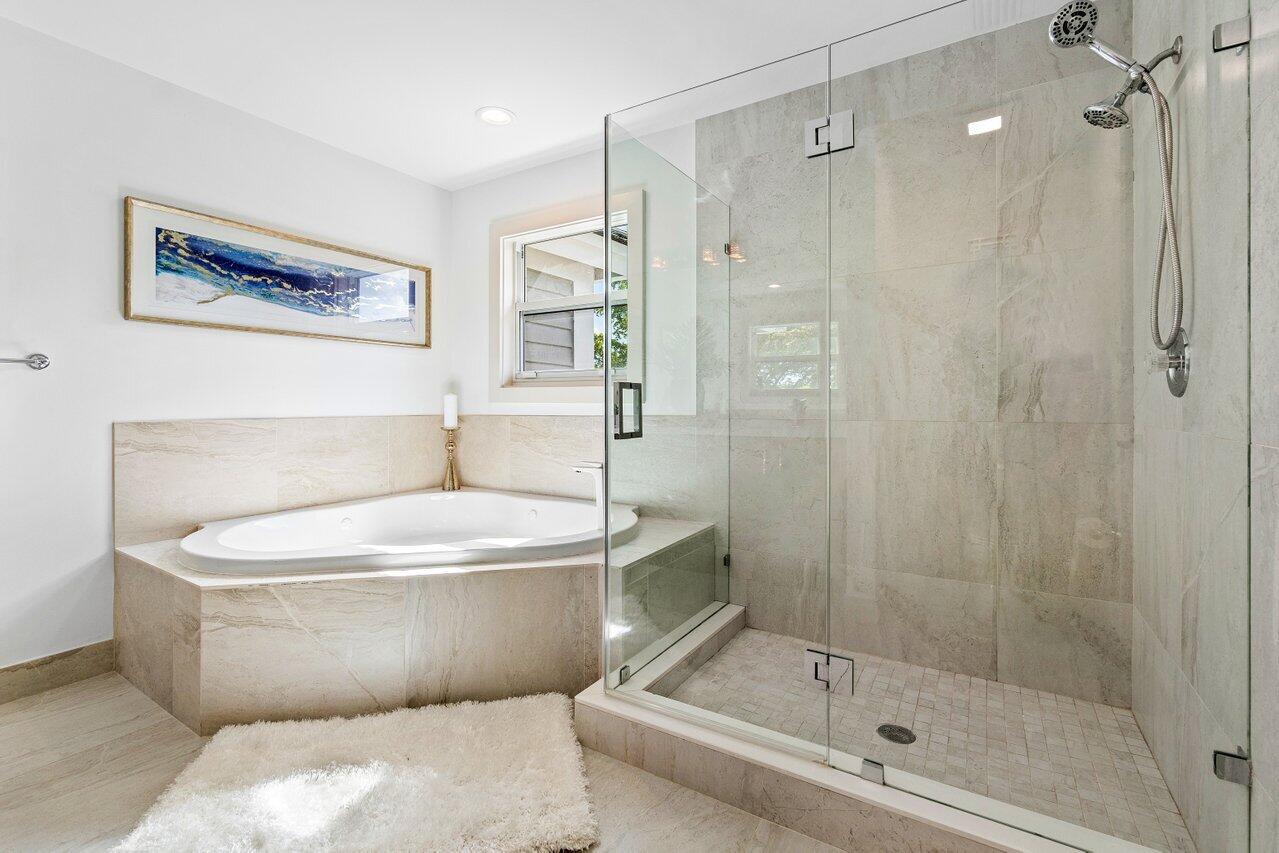5848 Northwest 39th Avenue Boca Raton, FL 33496 - Photo 21 of 37 a bathroom with a shower and a bathtub