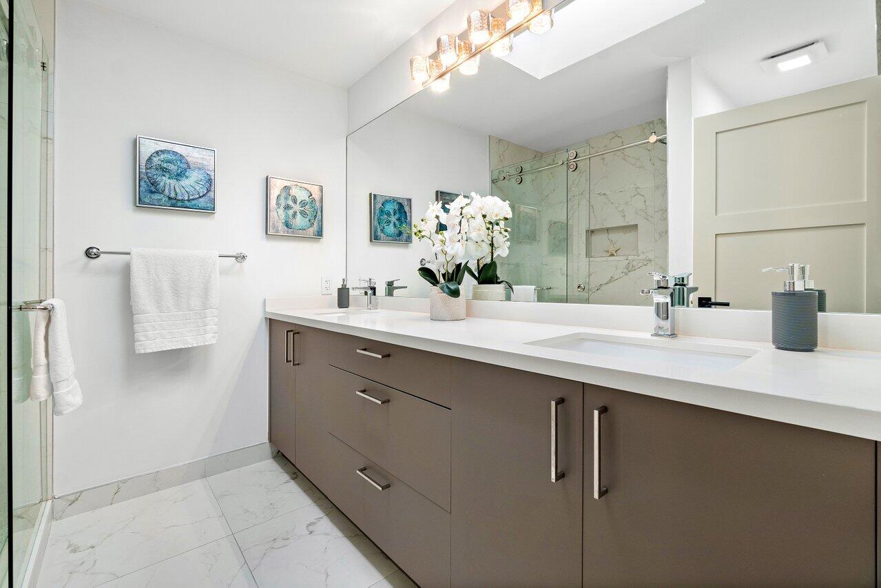 5848 Northwest 39th Avenue Boca Raton, FL 33496 - Photo 23 of 37 a bathroom with a double vanity sink mirror and vanity