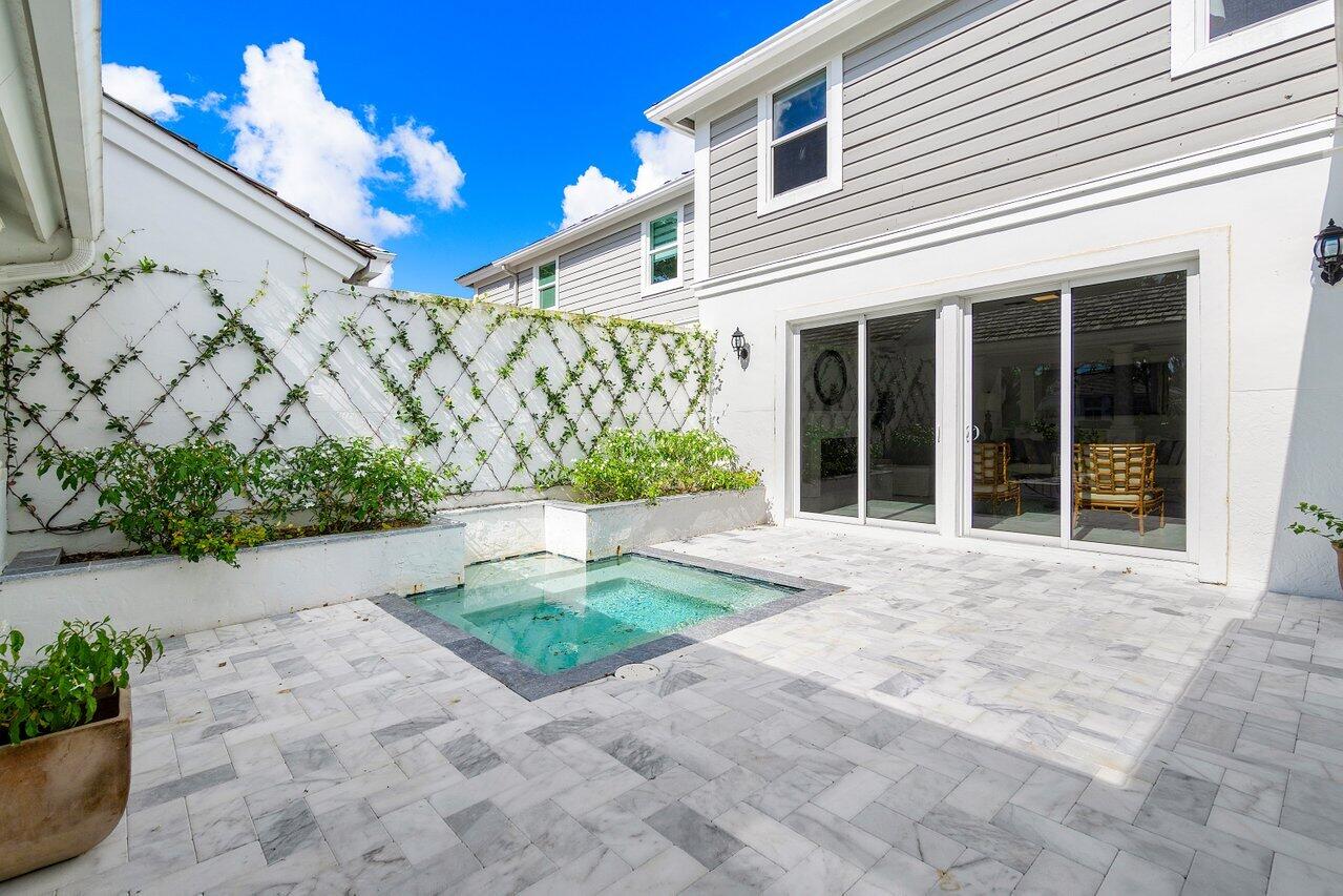 5848 Northwest 39th Avenue Boca Raton, FL 33496 - Photo 29 of 37 a house with garden in front of it