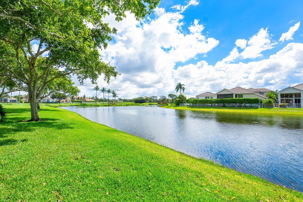 5848 Northwest 39th Avenue Boca Raton, FL 33496 - Photo 31 of 37 a view of a lake with houses in the back