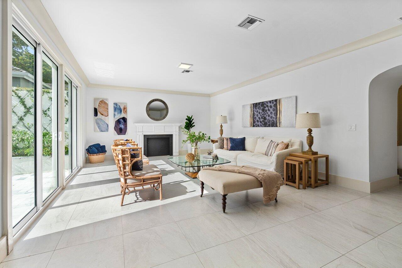 5848 Northwest 39th Avenue Boca Raton, FL 33496 - Photo 6 of 37 a bedroom with furniture and a fireplace