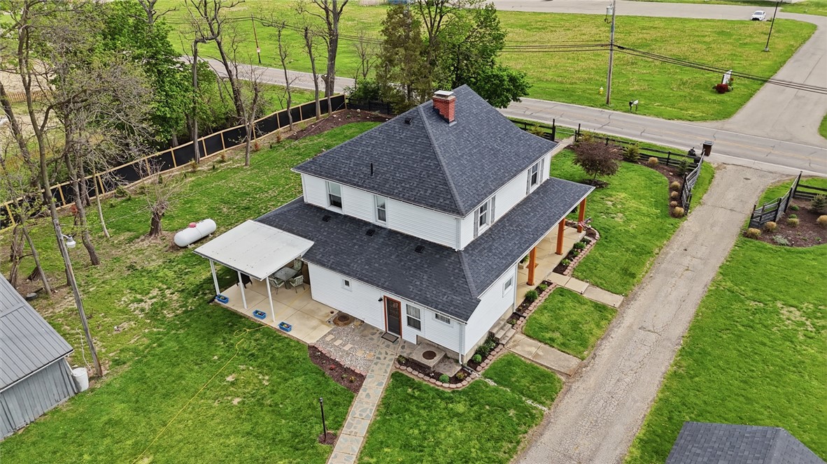 6155 North Union Road Clayton, OH 45315 - Photo 6 of 59 This charming home features a traditional design with lush surroundings, ideal for serene living.