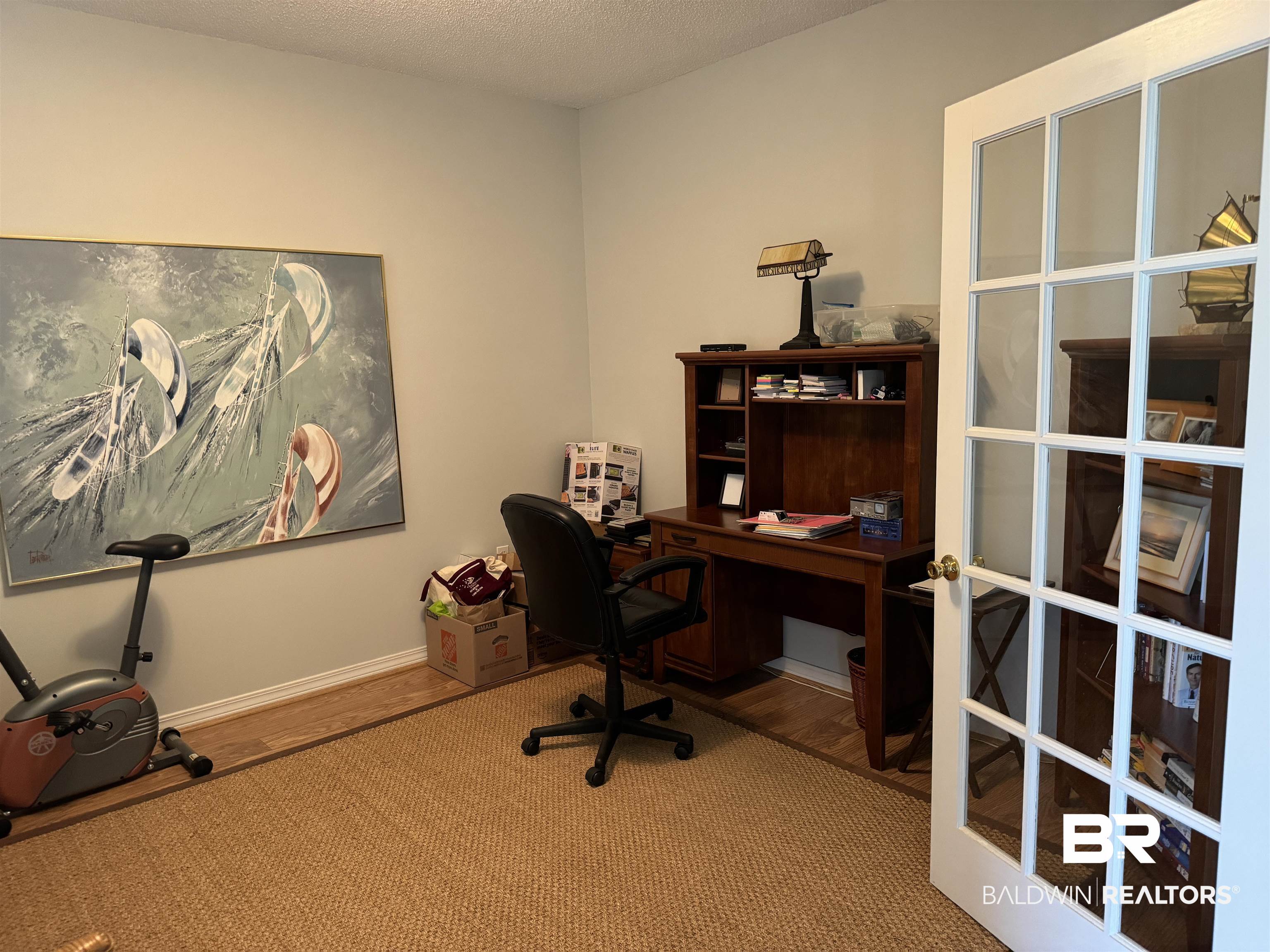9139 Clubhouse Drive Foley, AL 36535 - Photo 7 of 30 Office with hardwood / wood-style flooring, french doors, and a textured ceiling