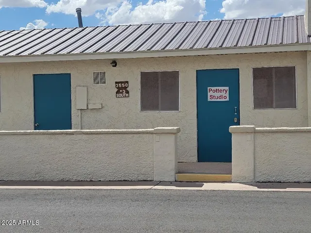 a view of a big yard with a fountain