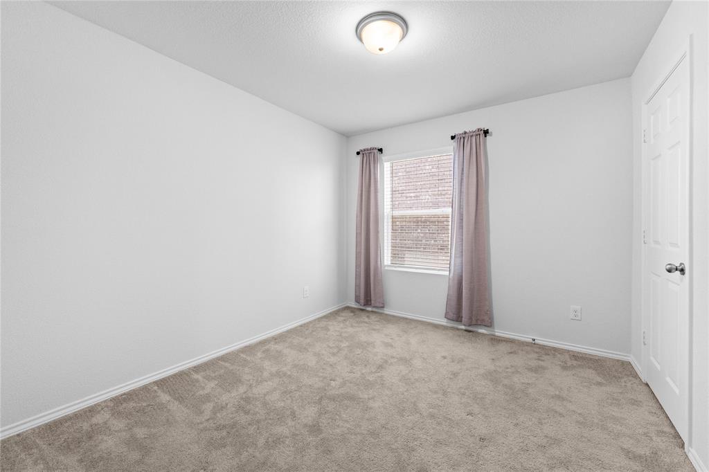 4432 Sagecroft Road Fort Worth, TX 76036 - Photo 9 of 16 Unfurnished bedroom featuring carpet floors and baseboards