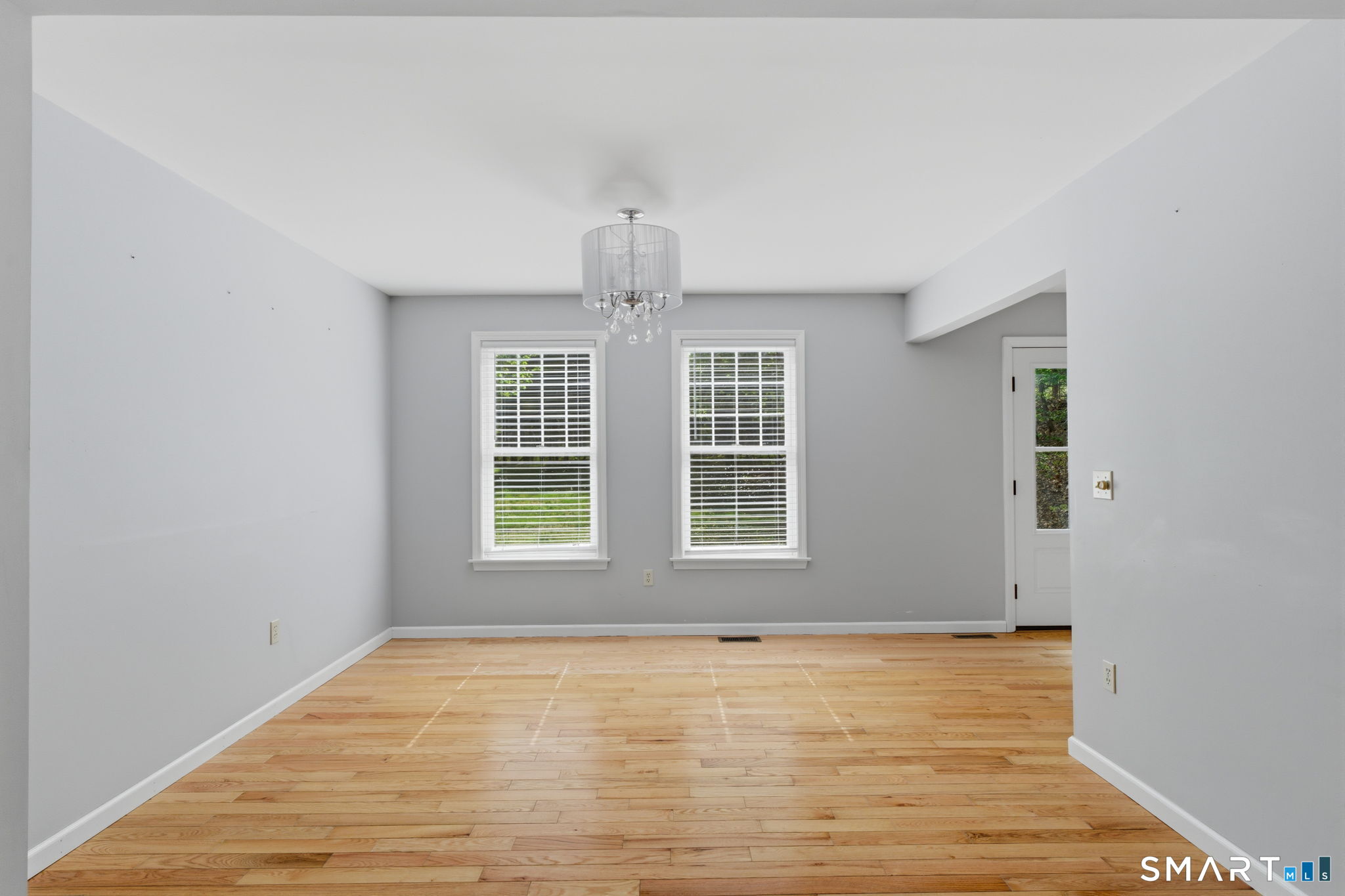 21 Greenwood Road North Granby, CT 06060 - Photo 10 of 40 an empty room with wooden floor and windows
