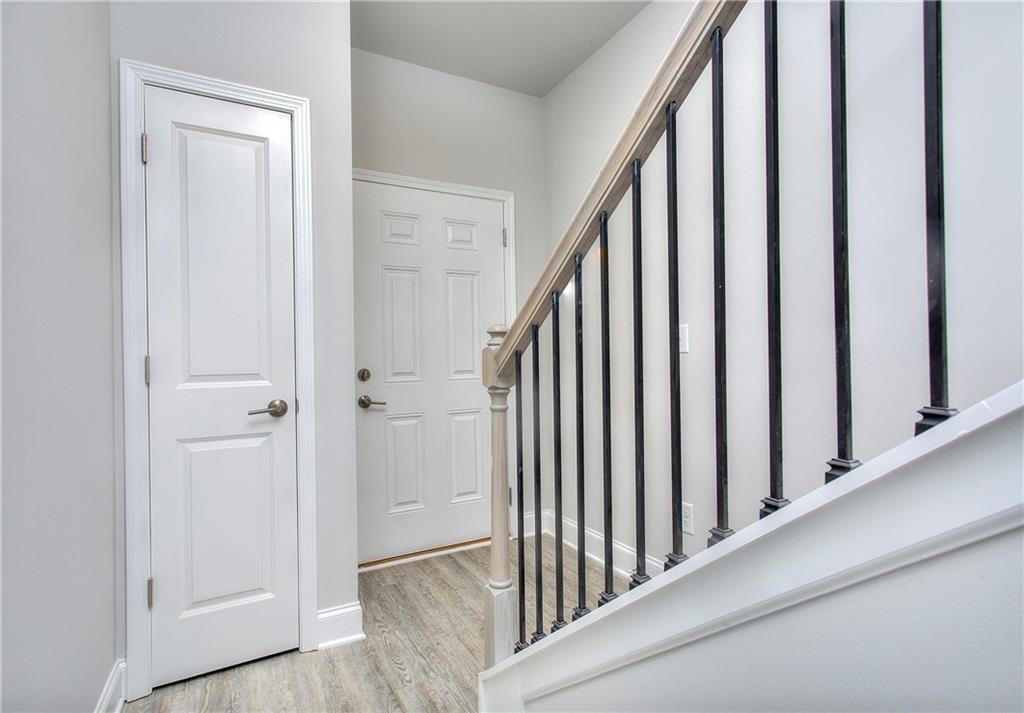 106 Greenview Court Cleveland, GA 30528 - Photo 2 of 29 a view of a hallway with wooden floor and staircase