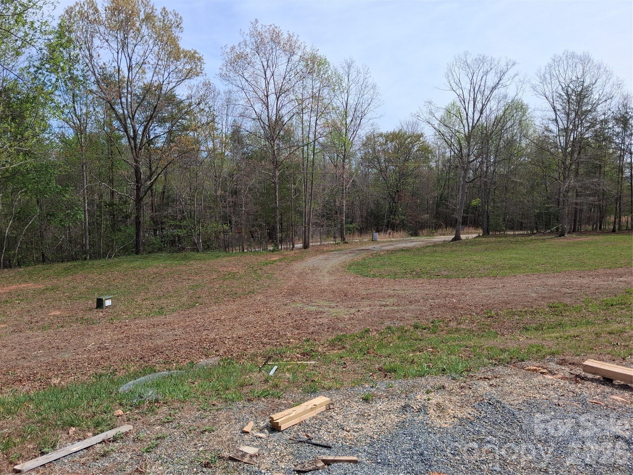 57 Hazel Drive, Unit 89 Nebo, NC 28761 - Photo 11 of 18 a backyard of a house with lots of green space