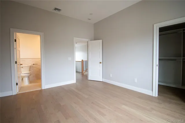 a bathroom with a toilet a sink and a mirror
