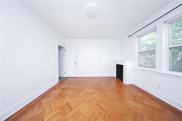 a view of an empty room with a window