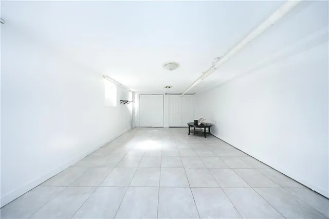 a view of a livingroom with closet and a window