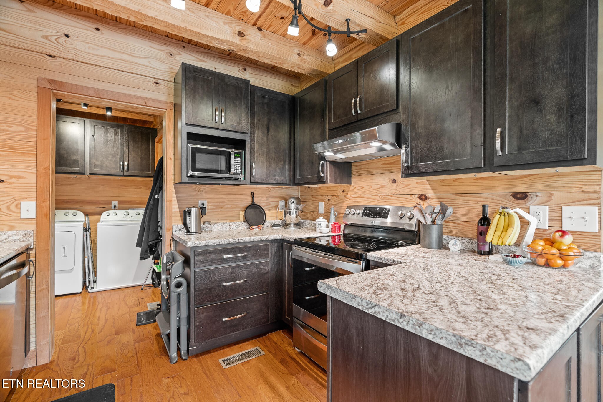 1055 Laurel Bluff Road Kingston, TN 37763 - Photo 13 of 35 a kitchen with granite countertop a stove a sink and dishwasher