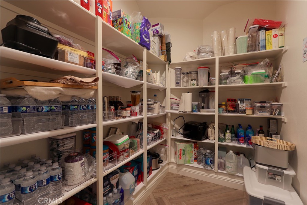 105 Iron Irvine, CA 92618 - Photo 17 of 47 a room with wine cabinets and a wooden floor