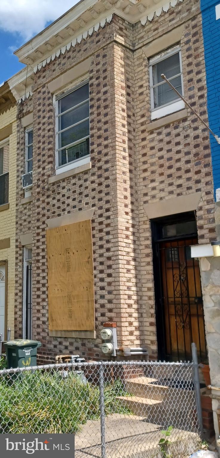 3003 Sherman Avenue Northwest Washington, DC 20001 - Photo 2 of 2 a front view of a house with garage