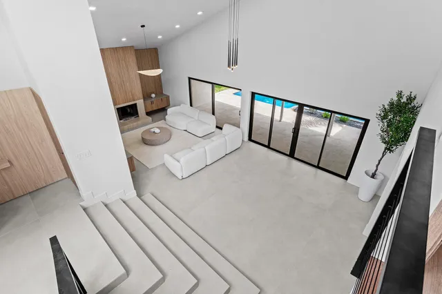 a large white bed in a white room