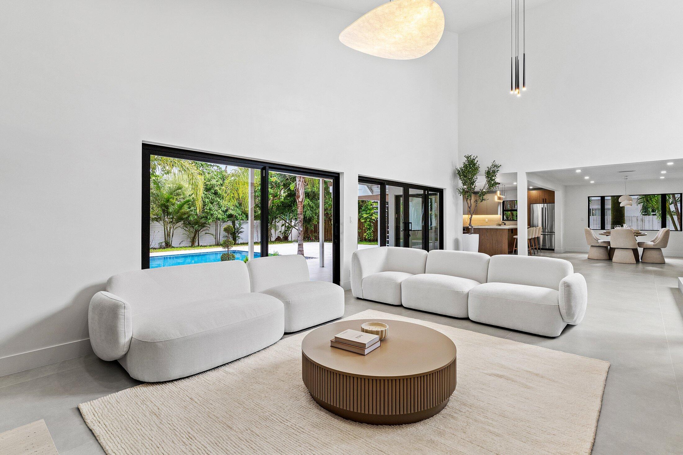 2668 Northwest 41st Street Boca Raton, FL 33434 - Photo 6 of 26 a living room with furniture and a large window