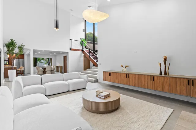 a living room with furniture and a table