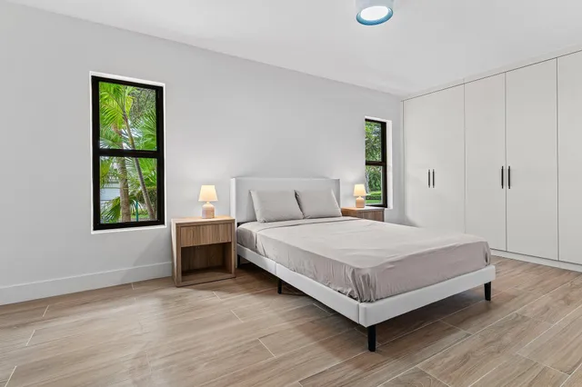 a bedroom with a bed and window