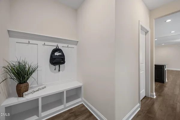 wooden floor in an empty room with a fireplace