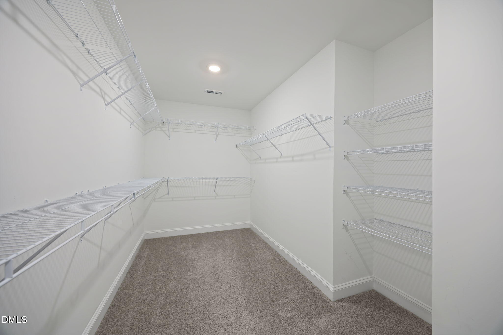 504 Henham Way Zebulon, NC 27597 - Photo 26 of 44 a view of a room with racks on the wall