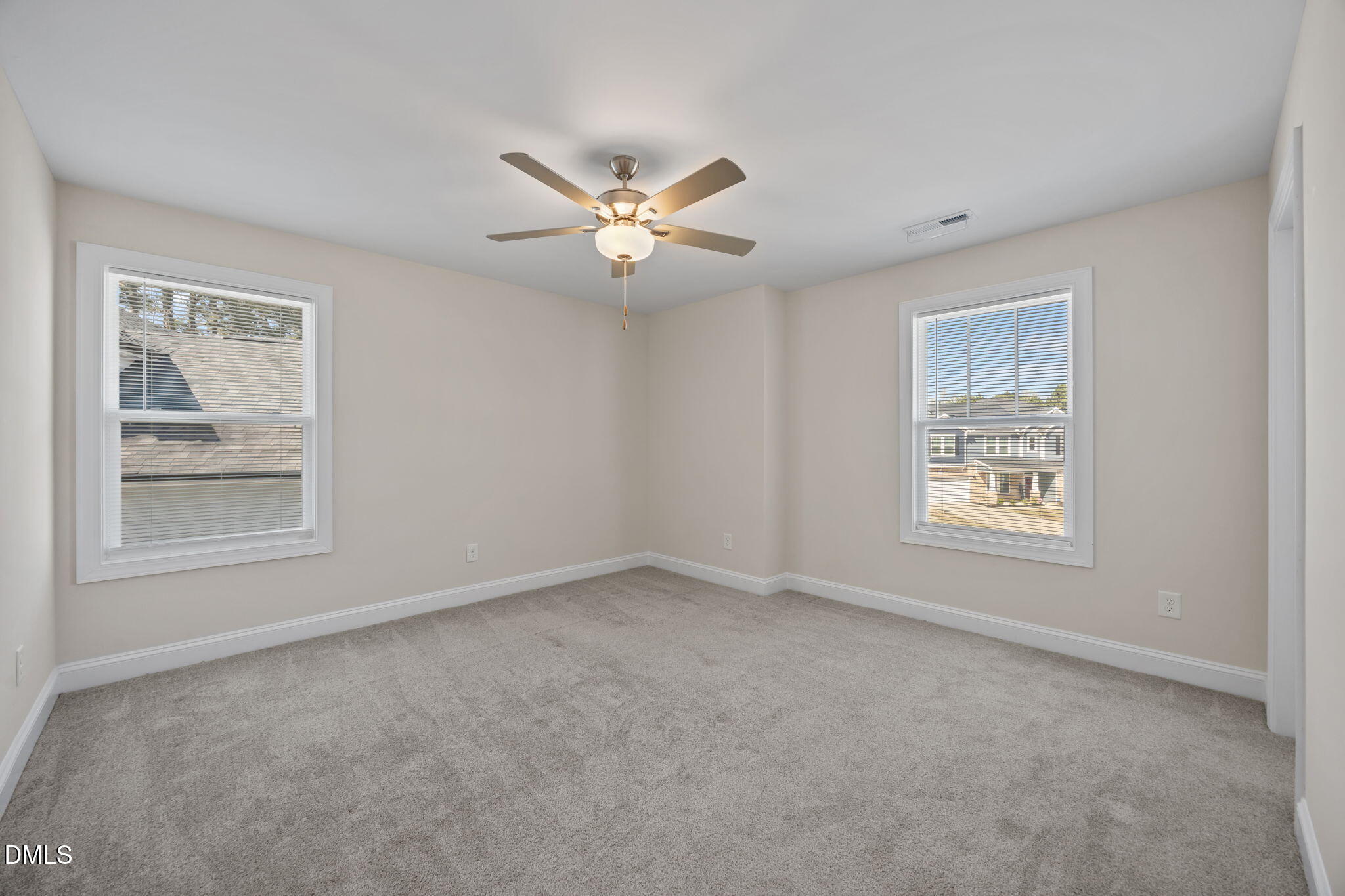 504 Henham Way Zebulon, NC 27597 - Photo 30 of 44 a view of an empty room with a window