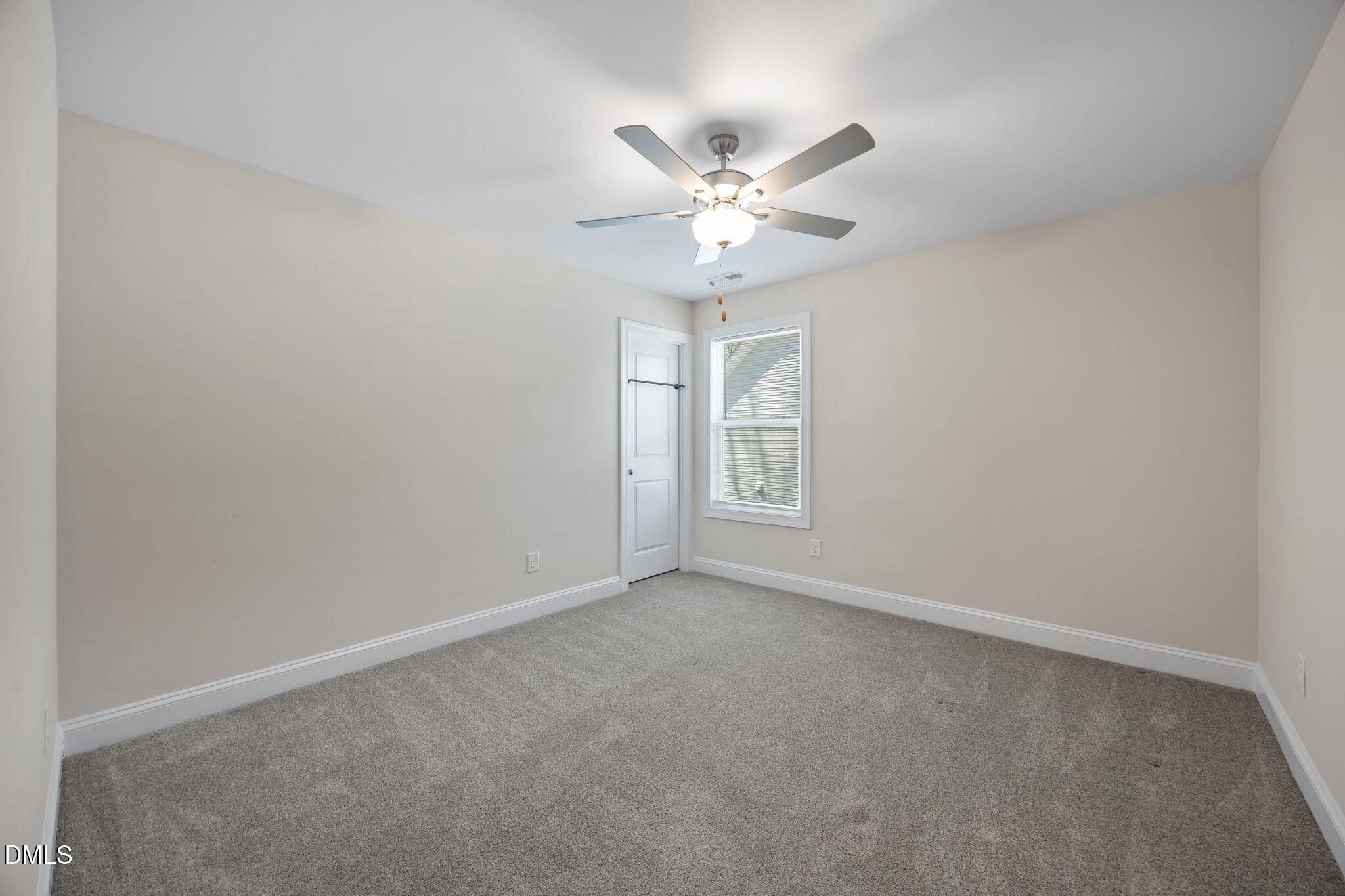 504 Henham Way Zebulon, NC 27597 - Photo 31 of 44 a view of an empty room with a window