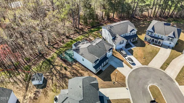 an aerial view of a house with outdoor space