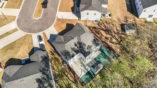 an aerial view of houses with outdoor space