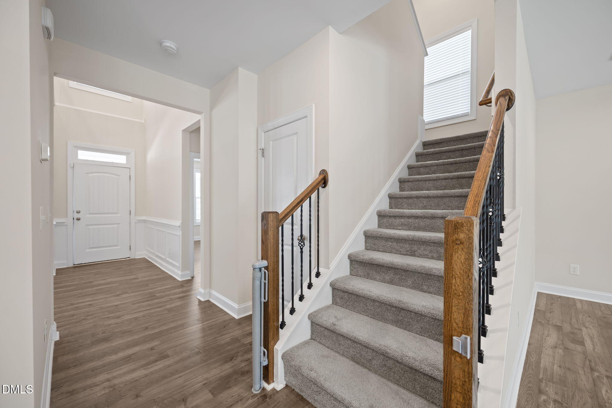 504 Henham Way Zebulon, NC 27597 - Photo 3 of 44 a view of an entryway with wooden floor