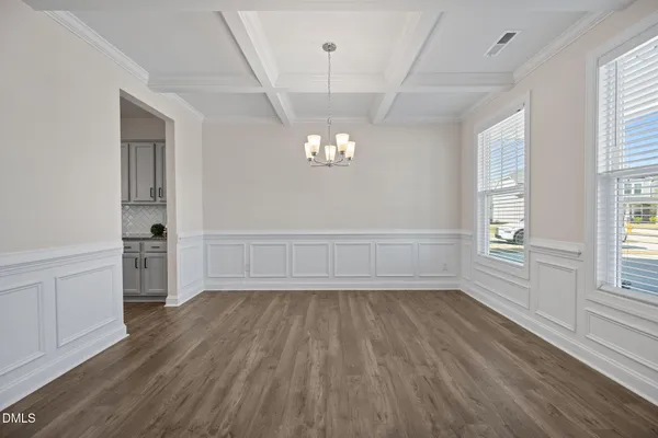 a view of an entryway with wooden floor
