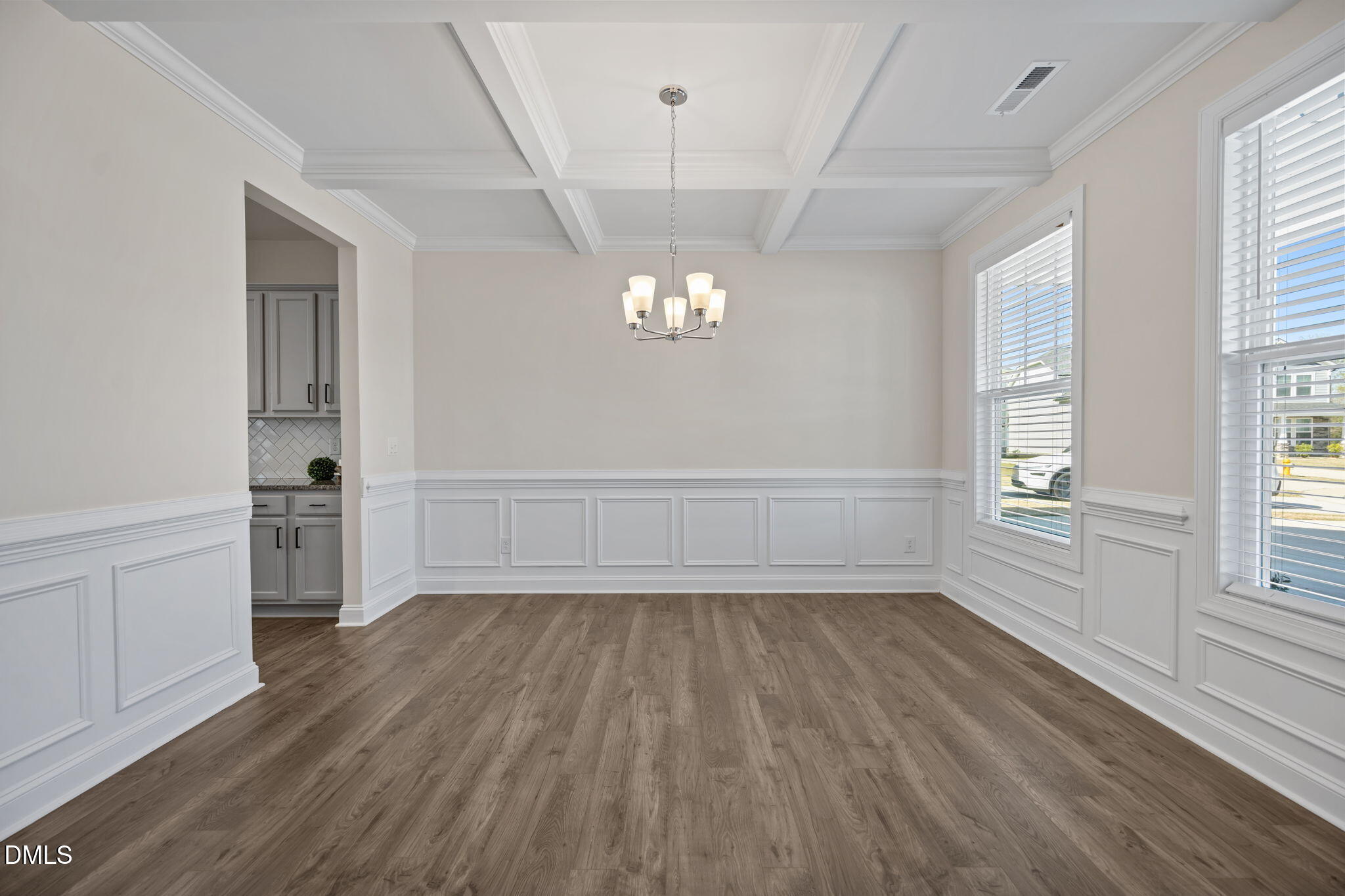 504 Henham Way Zebulon, NC 27597 - Photo 4 of 44 wooden floor in an empty room with a window