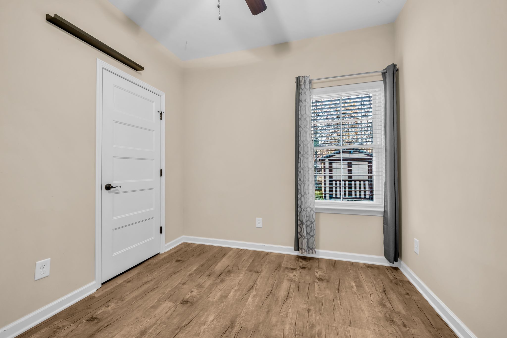 116 Eno Road Dickson, TN 37055 - Photo 14 of 28 an empty room with wooden floor and windows