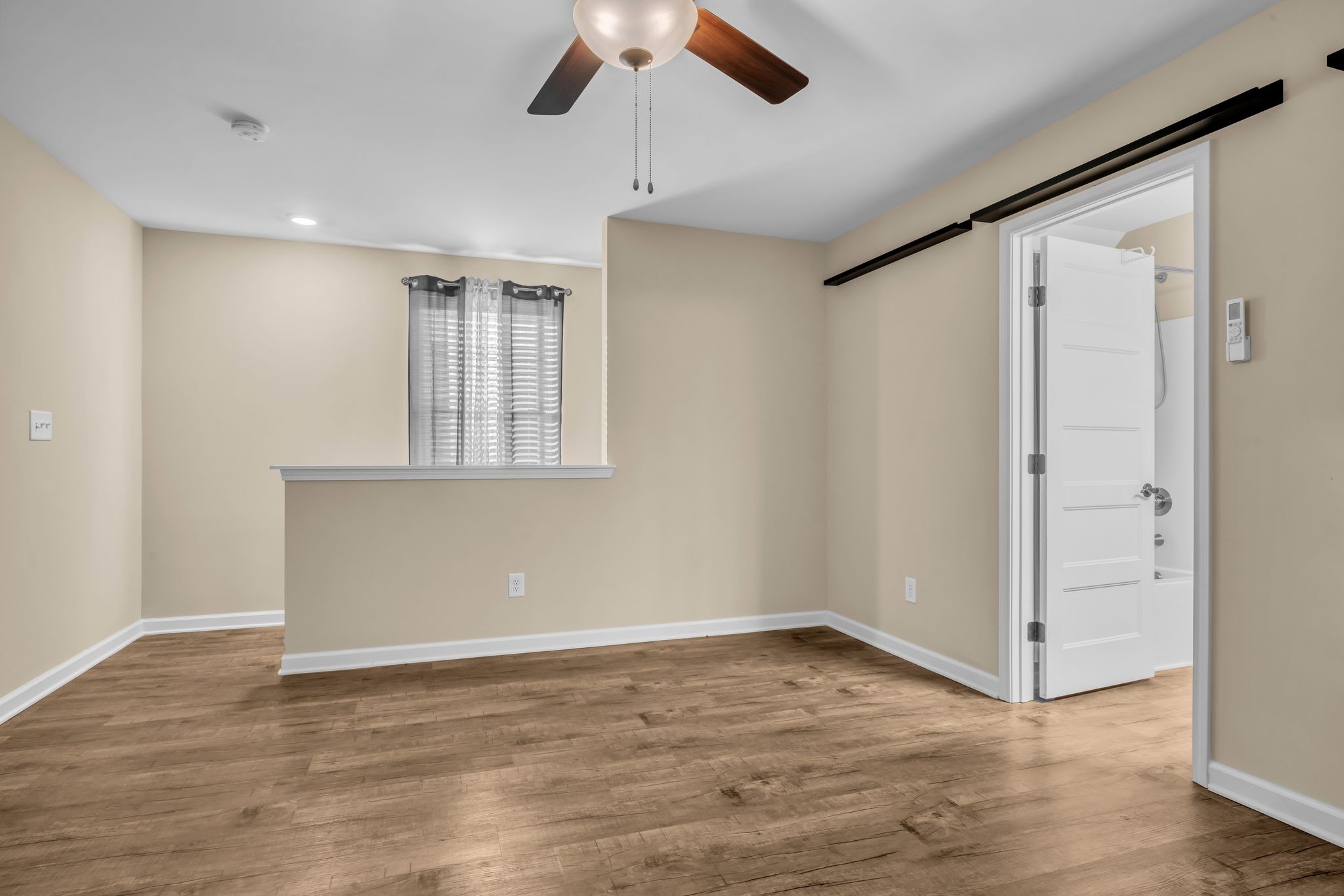 116 Eno Road Dickson, TN 37055 - Photo 18 of 28 wooden floor in an empty room with a window