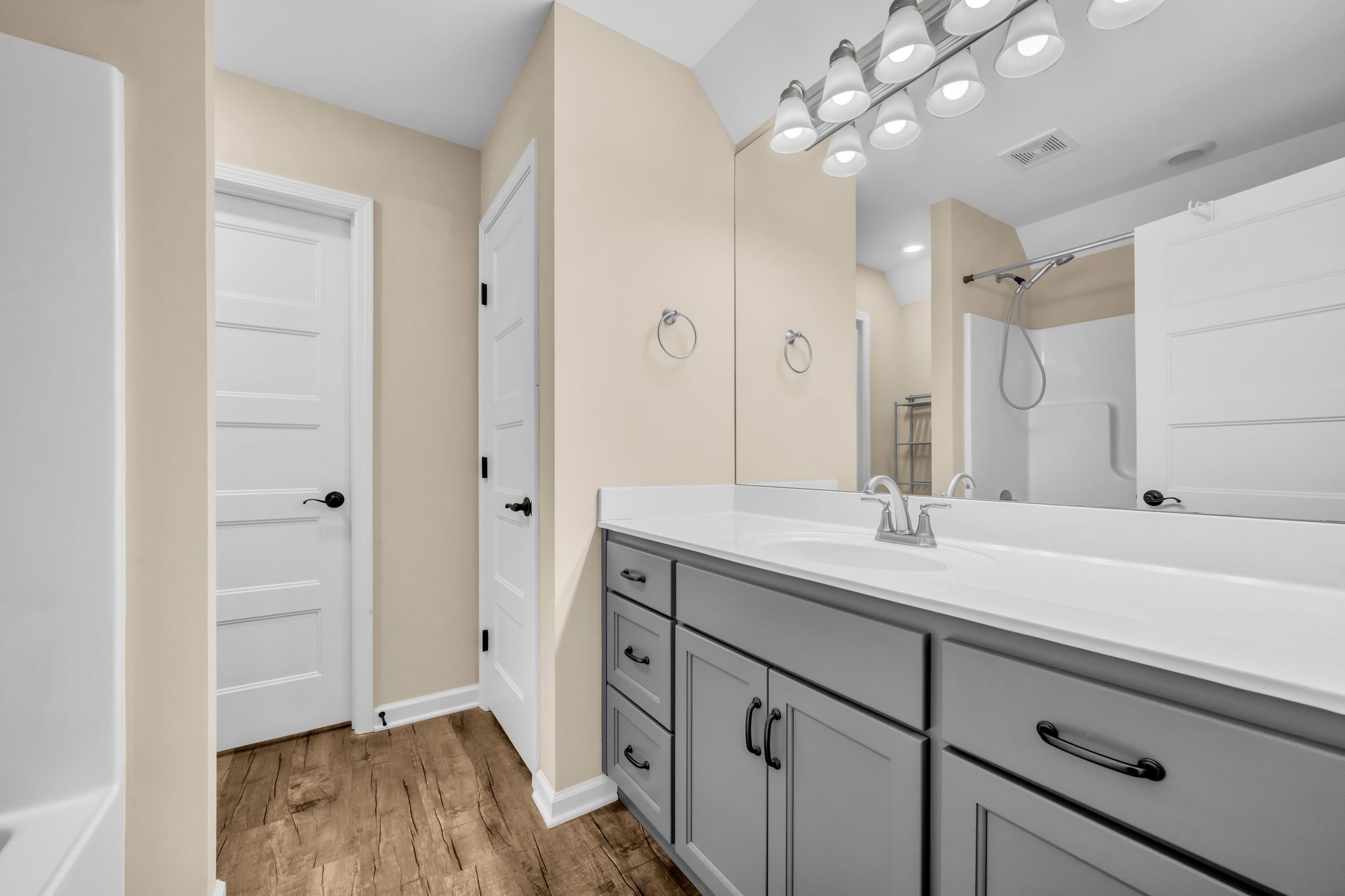 116 Eno Road Dickson, TN 37055 - Photo 20 of 28 a spacious bathroom with a granite countertop sink a mirror and a shower