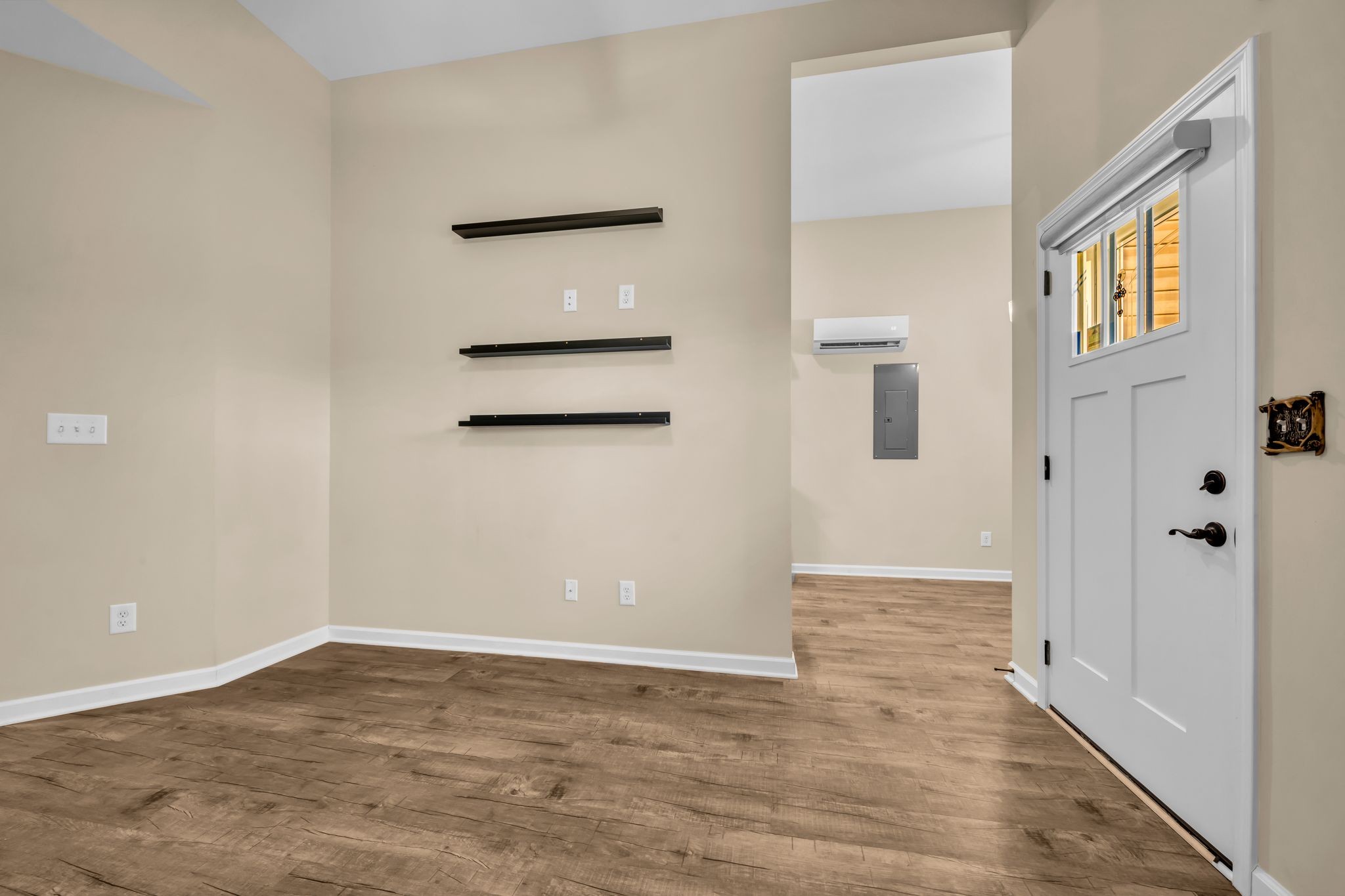 116 Eno Road Dickson, TN 37055 - Photo 4 of 28 a view of an empty room with wooden floor and a window