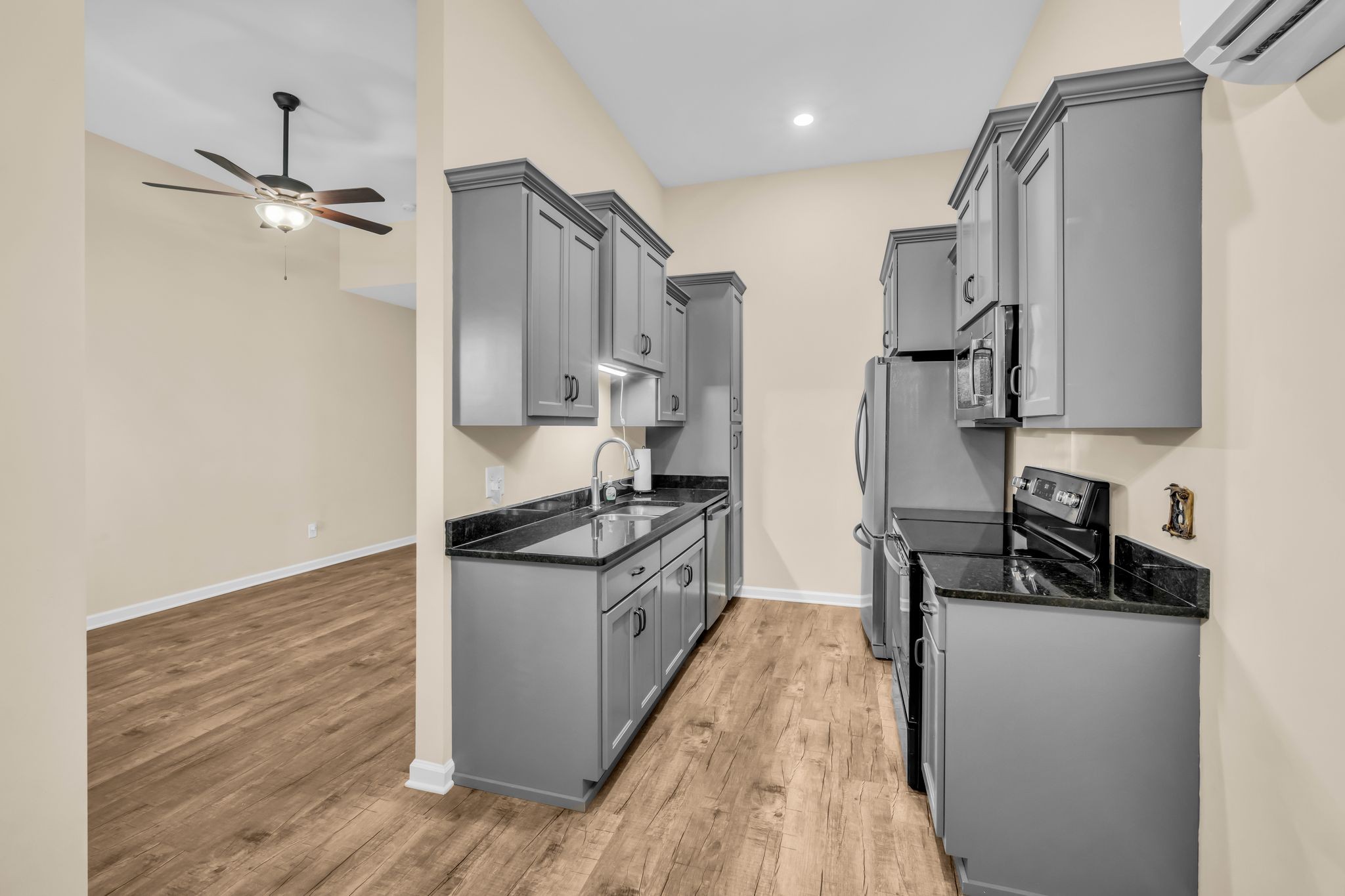 116 Eno Road Dickson, TN 37055 - Photo 7 of 28 a kitchen with stainless steel appliances granite countertop a sink stove and refrigerator