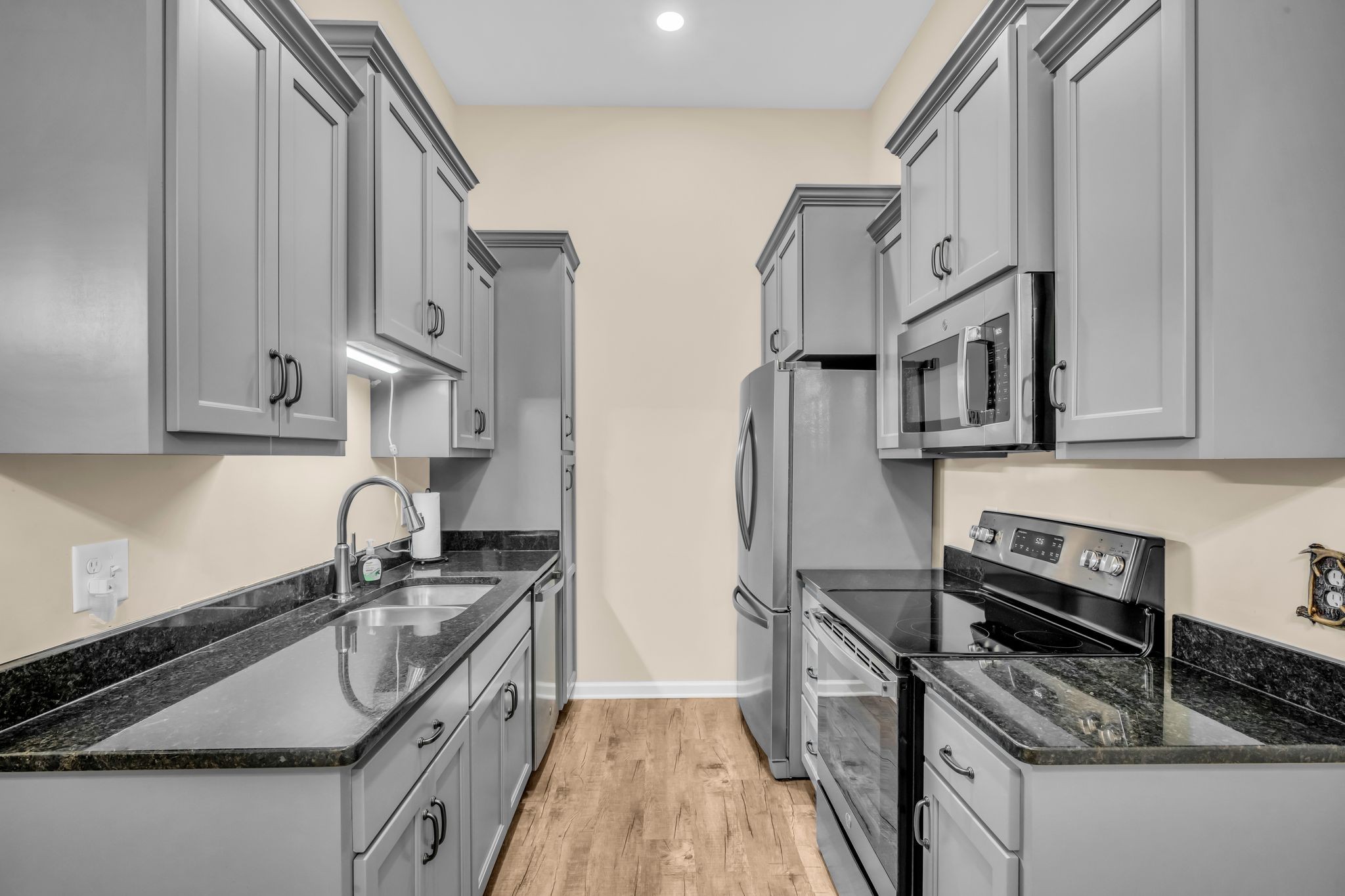 116 Eno Road Dickson, TN 37055 - Photo 8 of 28 a kitchen with stainless steel appliances granite countertop a sink stove and refrigerator