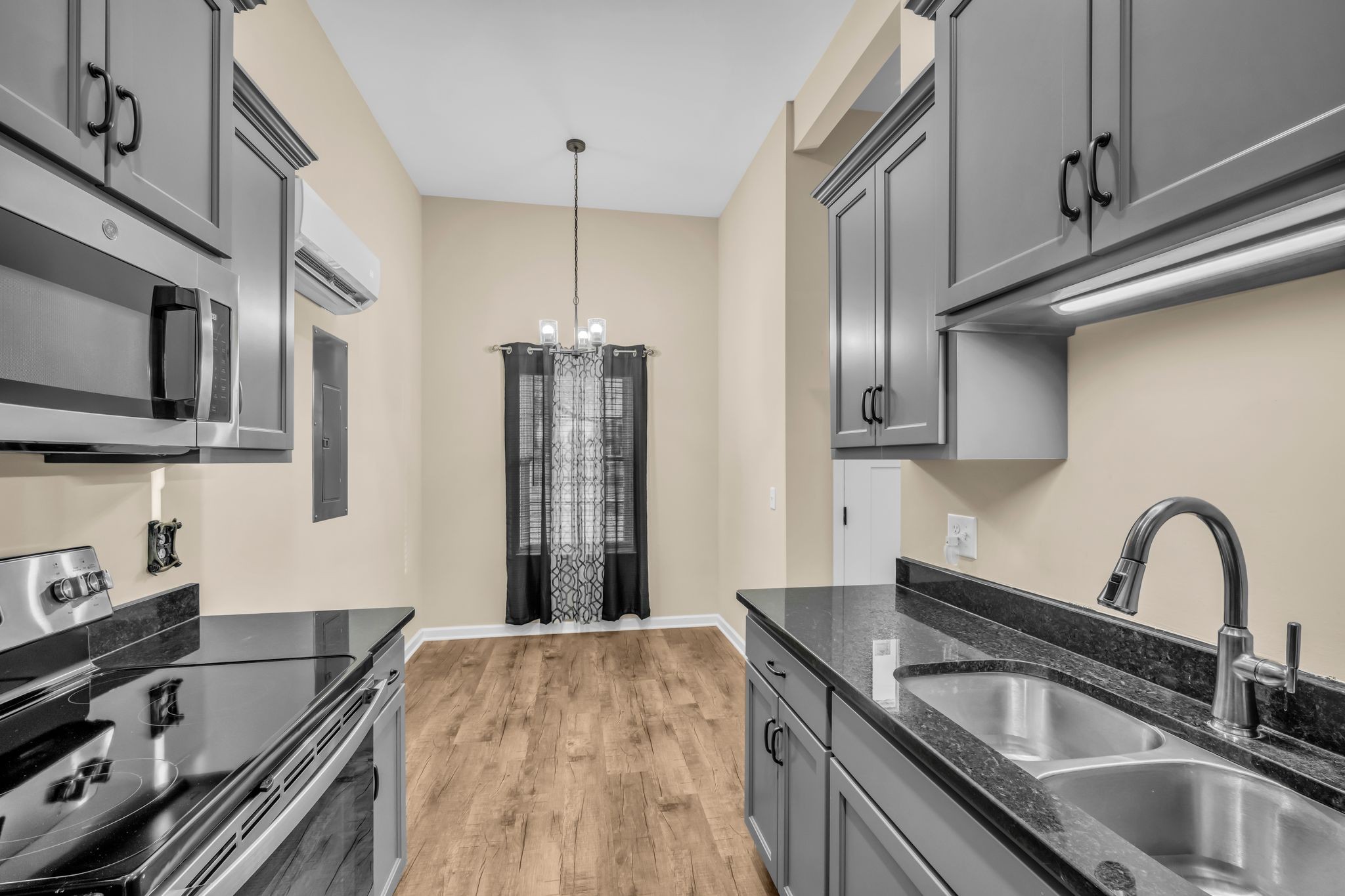 116 Eno Road Dickson, TN 37055 - Photo 9 of 28 a kitchen with stainless steel appliances granite countertop a sink stove and refrigerator